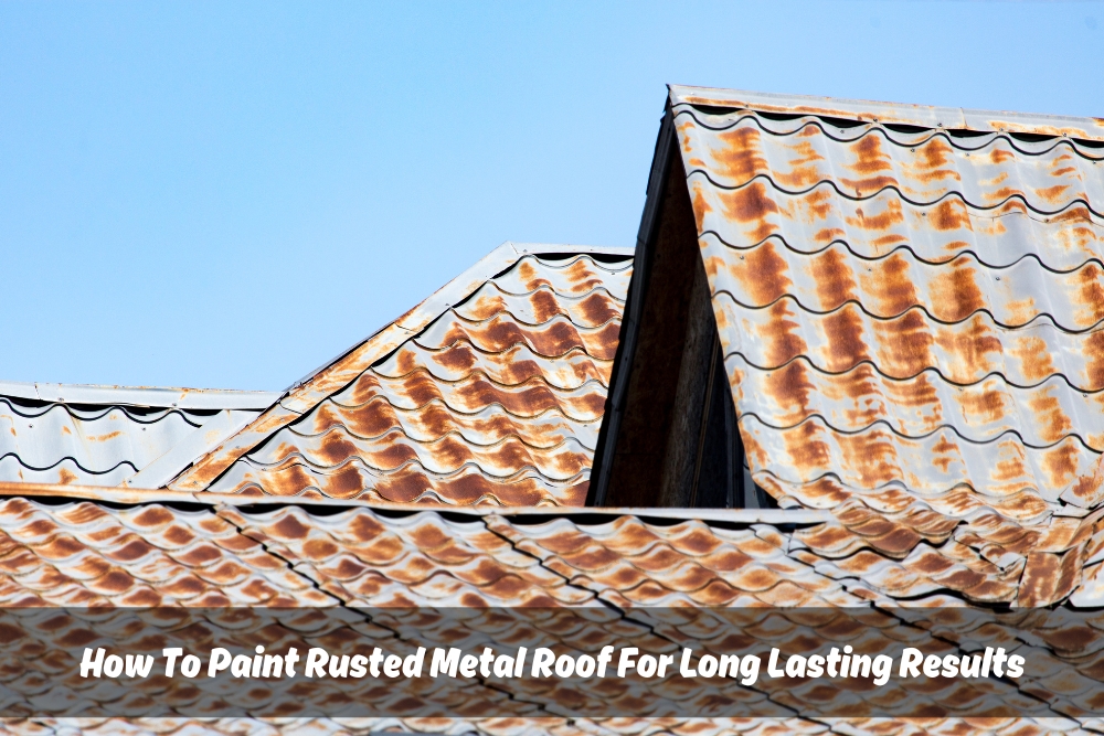 A close-up view of a rusted metal roof with significant rust spots under a clear blue sky. The text overlay reads 'How To Paint Rusted Metal Roof For Long Lasting Results'.