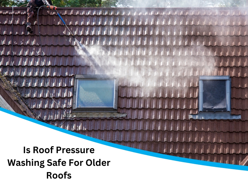 A close-up of a pressure washer cleaning a tiled roof. Roof Pressure Washing Safety